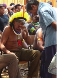 A person approaches a chief