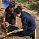 students digging with pickaxe
