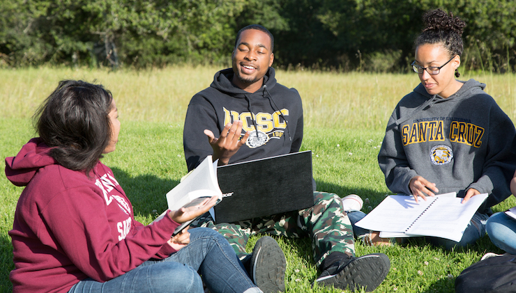 Students speaking in field